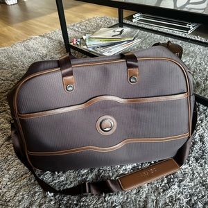Delsey carry on duffel in brown with red interior